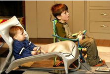 Two little boys playing video games